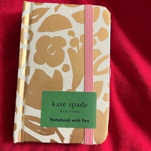 Kate Spade pocket notebook w pen, Gold and cream w pink, brand new with tag